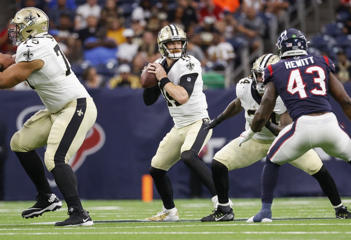 Aug 13, 2022; New Orleans Saints quarterback Andy Dalton (14) looks for a receiver during a game against the Houston Texans. Mandatory Credit: Troy Taormina-USA TODAY